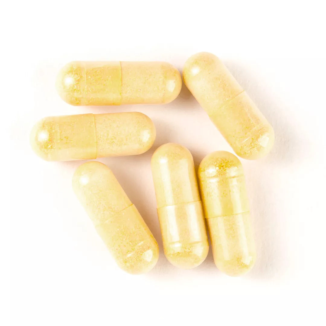 Yellow capsules on a white background