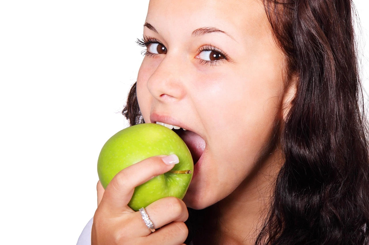 Healthy food woman eating apple